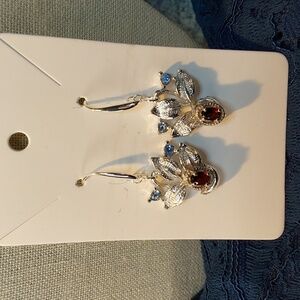 Handmade Silverstone with garnets and blue crystal